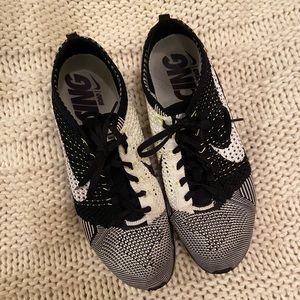 Gently worn Nike FlyKnit Racer in Orca/Volt!
